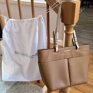 Michael Kors classic cognac with sand straps leather midsized handbag.